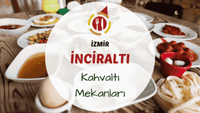 İzmir İnciraltı kahvaltı mekanlarını gösteren deniz kıyısında, ağaçlar arasında kurulmuş Ege lezzetleriyle dolu kahvaltı masası görseli